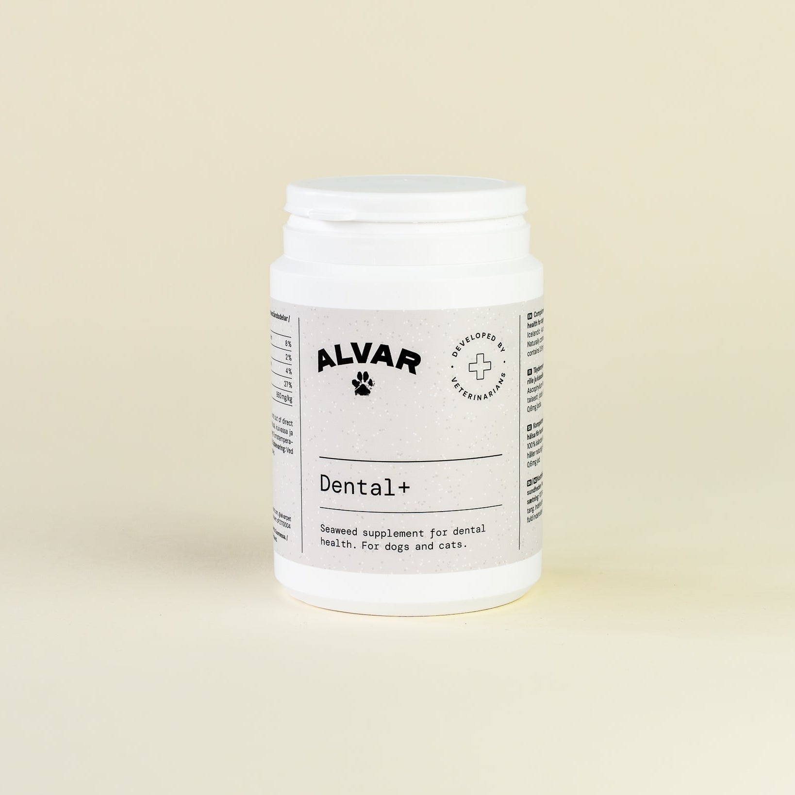 Jar of Alvar Dental+ supplement on a beige background