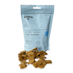 A package of Alvar Fish Softies dog treats with several treats visible in front of the package.
